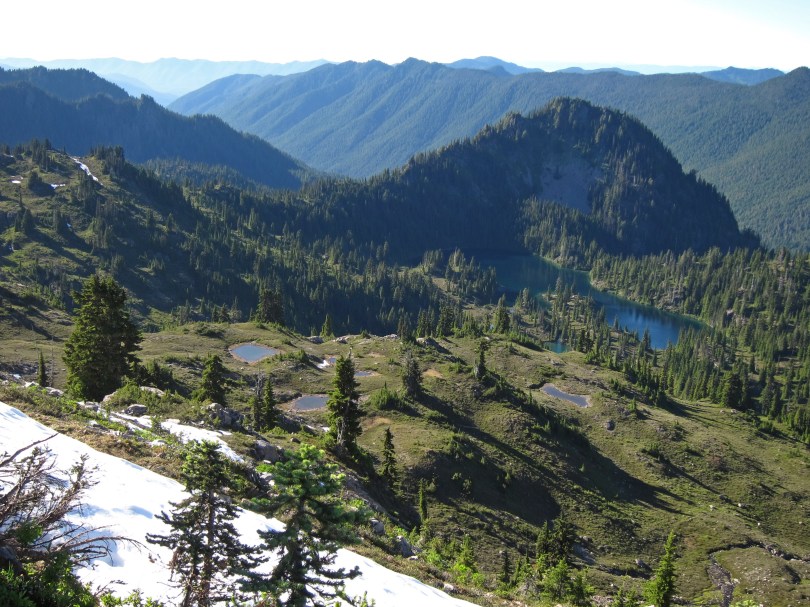 Seen here from the High Divide Trail, Seven Lakes Basin is unaltered by campsites or social trails. Designated campsites are tucked away, not visible.
